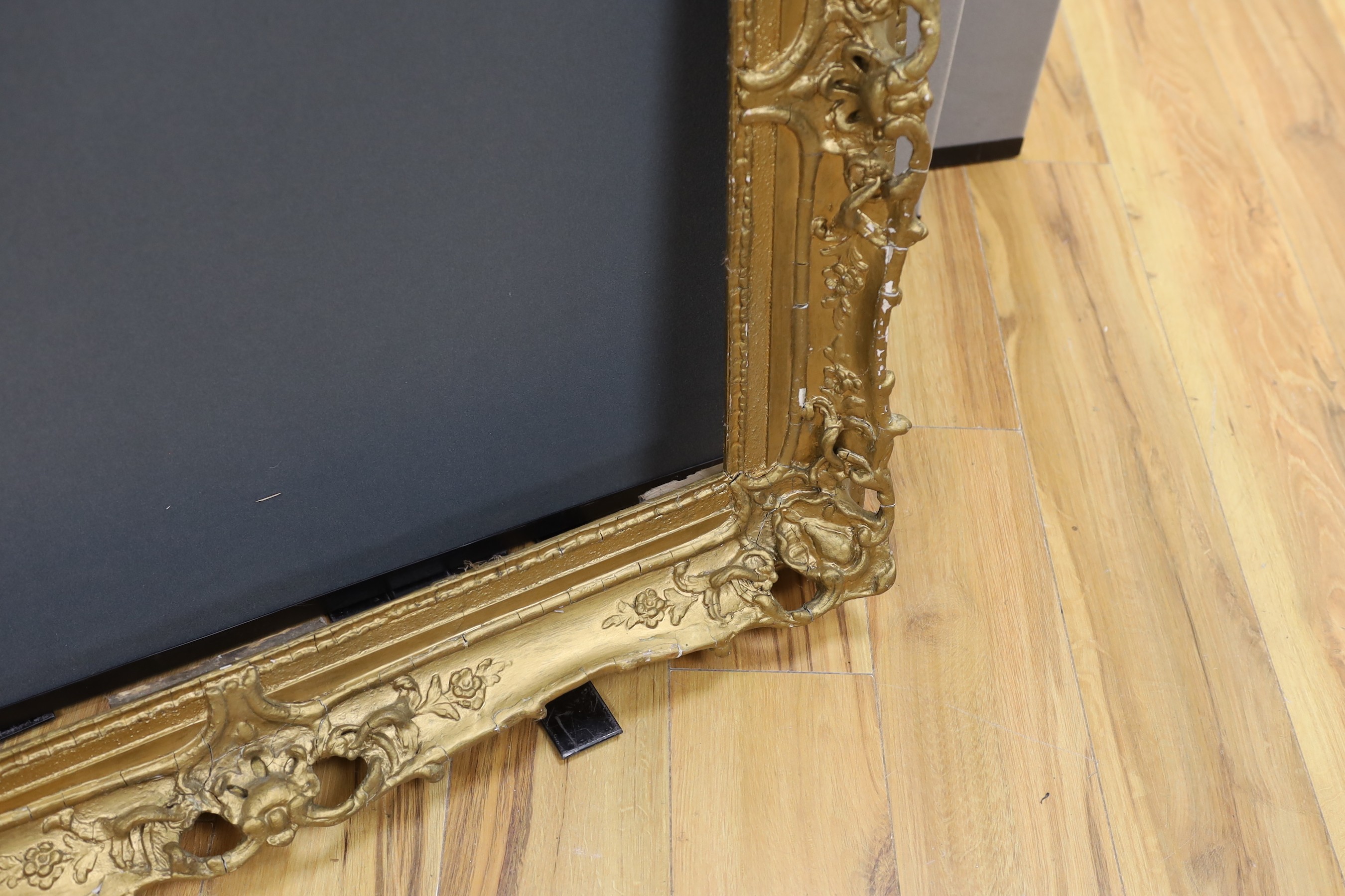 An ornate painted gilt picture frame, 90 x 100cm overall